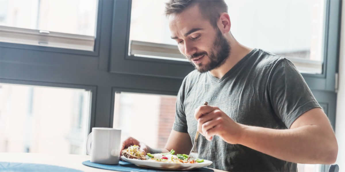 An image of a man eating a healthy diet