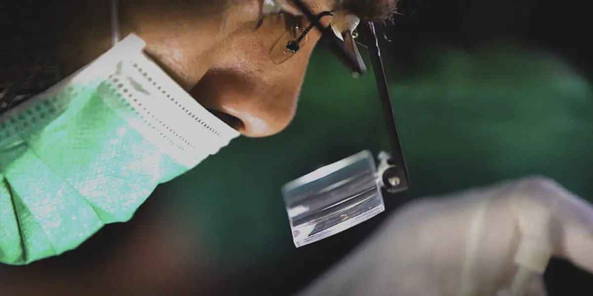 Hair transplant surgeon up close doing Direct Hair Implantation DHI